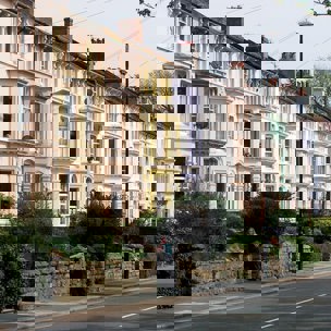 street of houses with gardens in uk