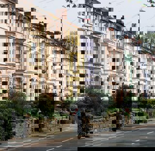 street of houses with gardens in uk