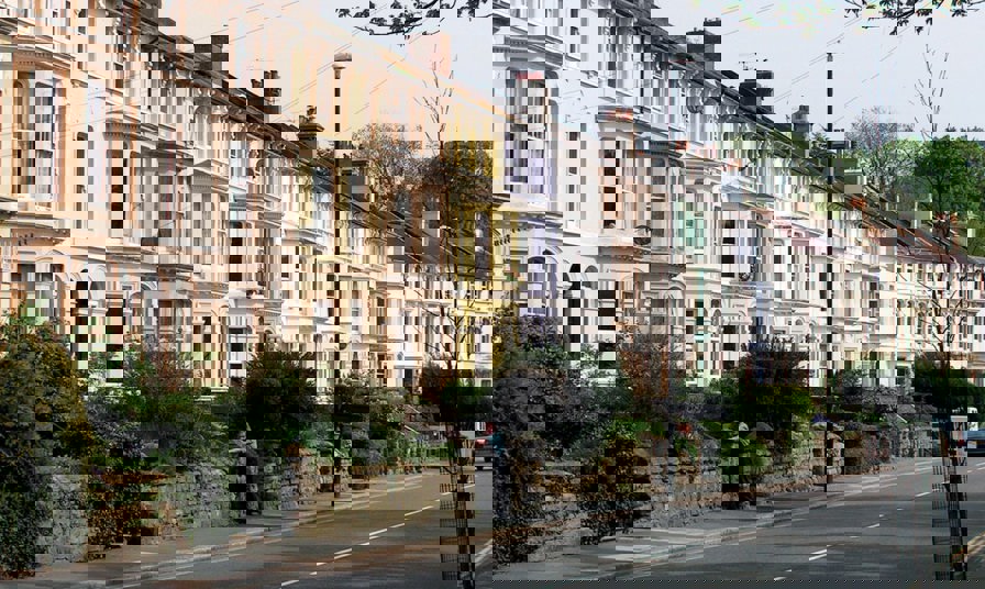 street of houses with gardens in uk